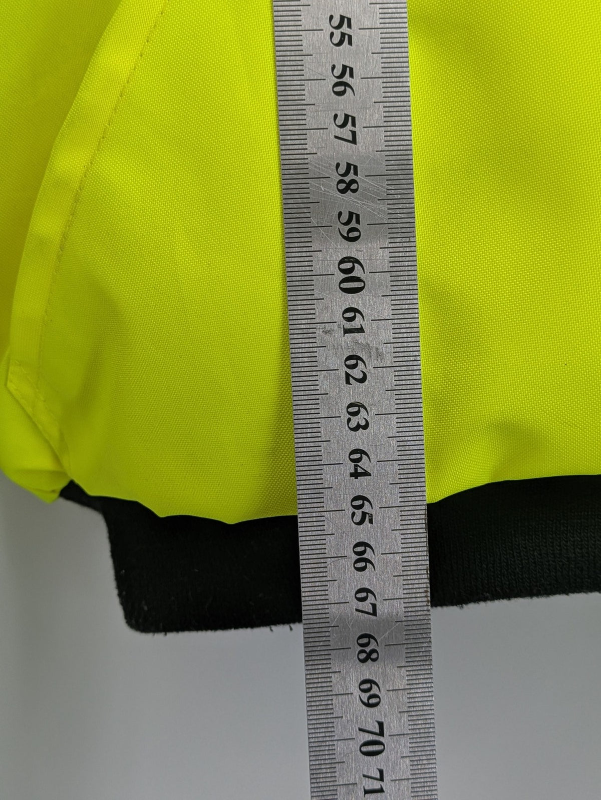 Hüren OHG grey and neon yellow safety jacket with reflective stripes and zippered arm pocket.