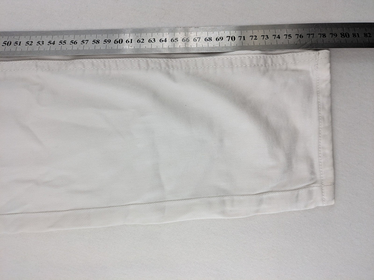 Denim 1982 white skinny jeans with distressed details and classic 5-pocket design.