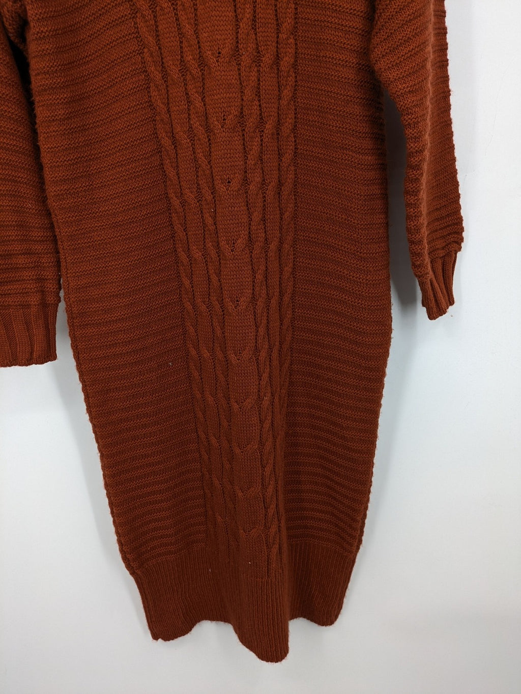 Braun brown turtle neck jumper with decorative cable knit pattern and long sleeves.