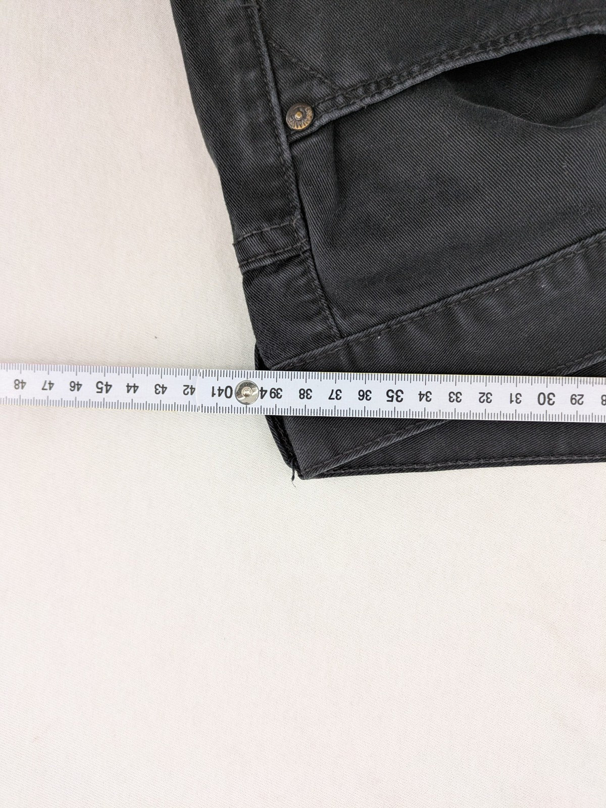 Ckh grey straight fit jeans with button fly and faded wash details.