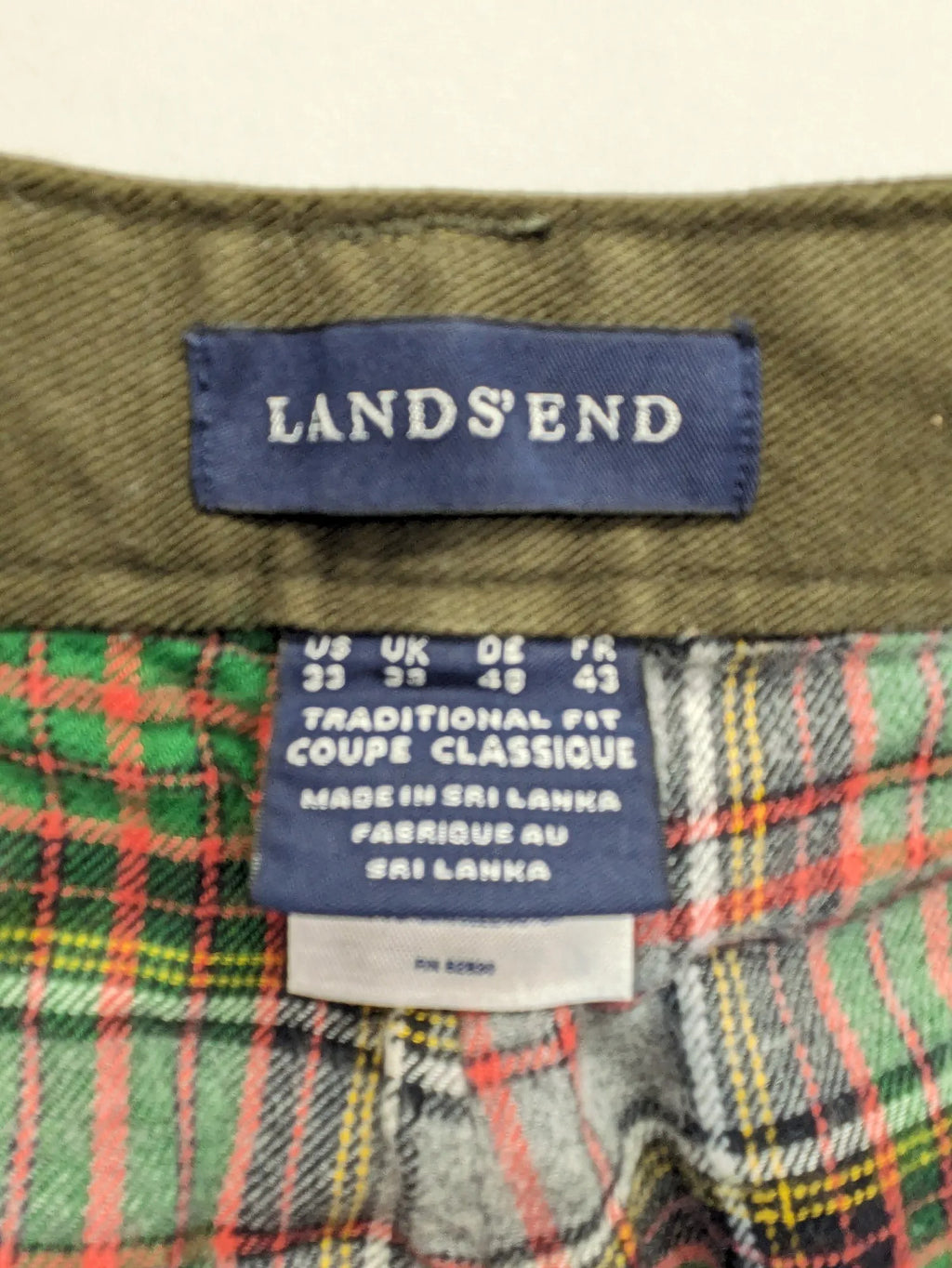 Lands' End green cargo pants with plaid flannel lining and traditional fit design.