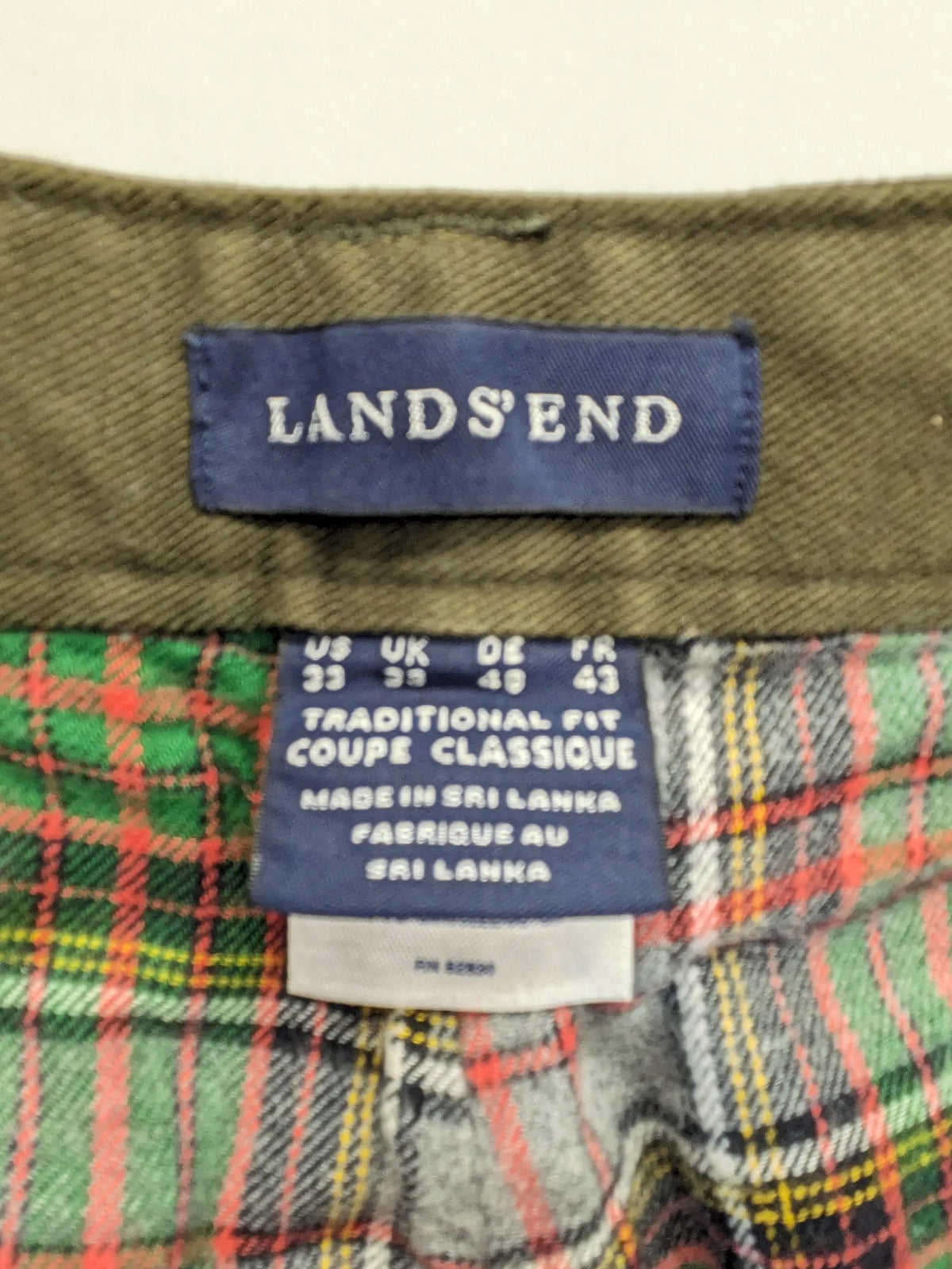 Lands' End green cargo pants with plaid flannel lining and traditional fit design.