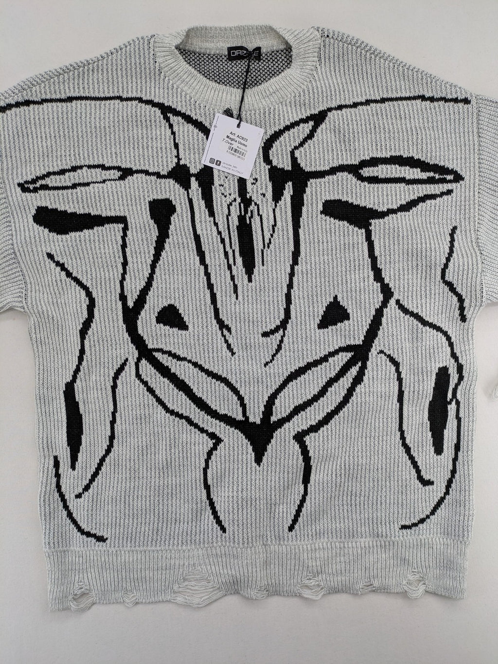 Drizzle turtle neck jumper black grey with abstract graphic print and distressed details.