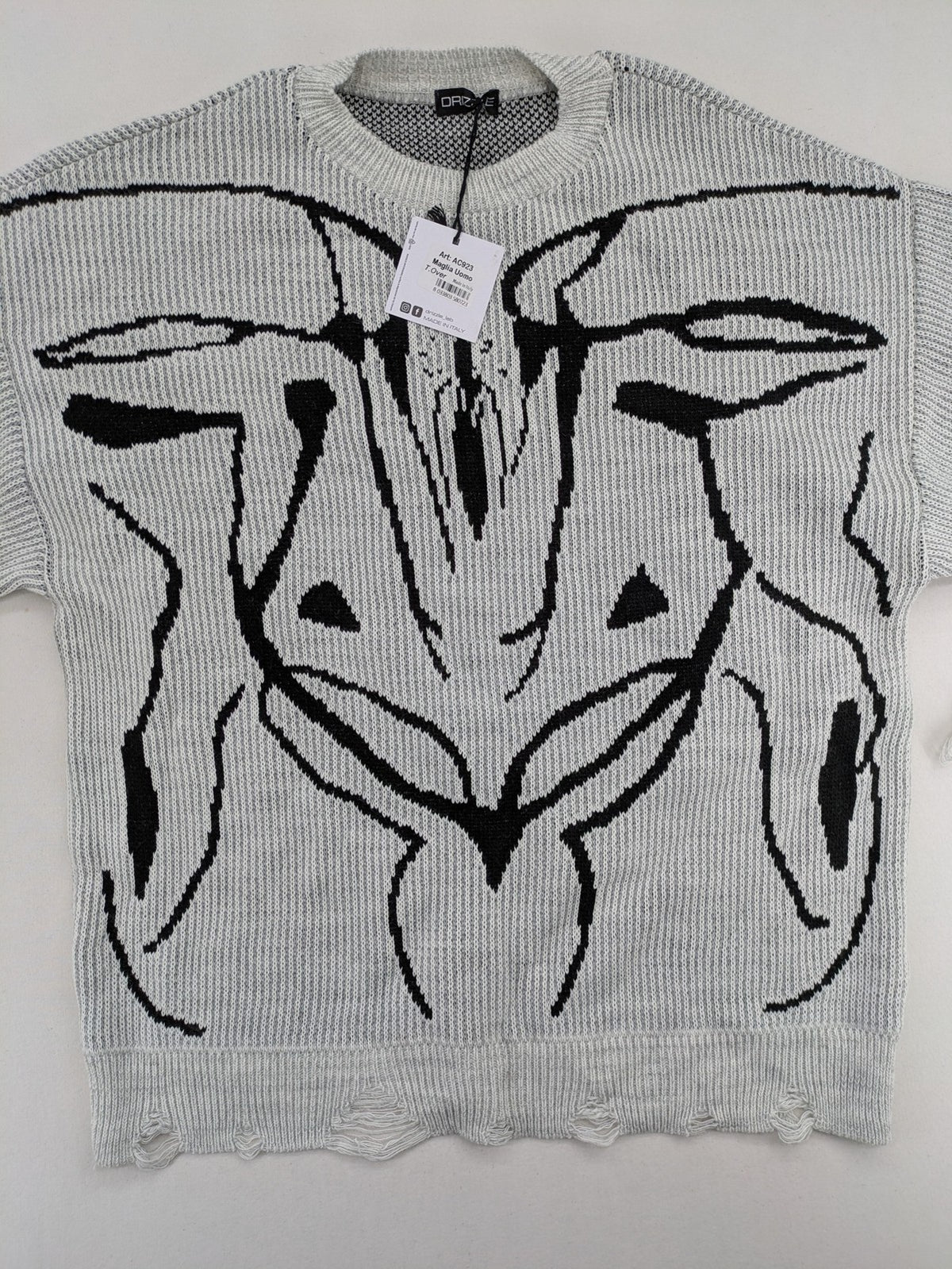 Drizzle turtle neck jumper black grey with abstract graphic print and distressed details.