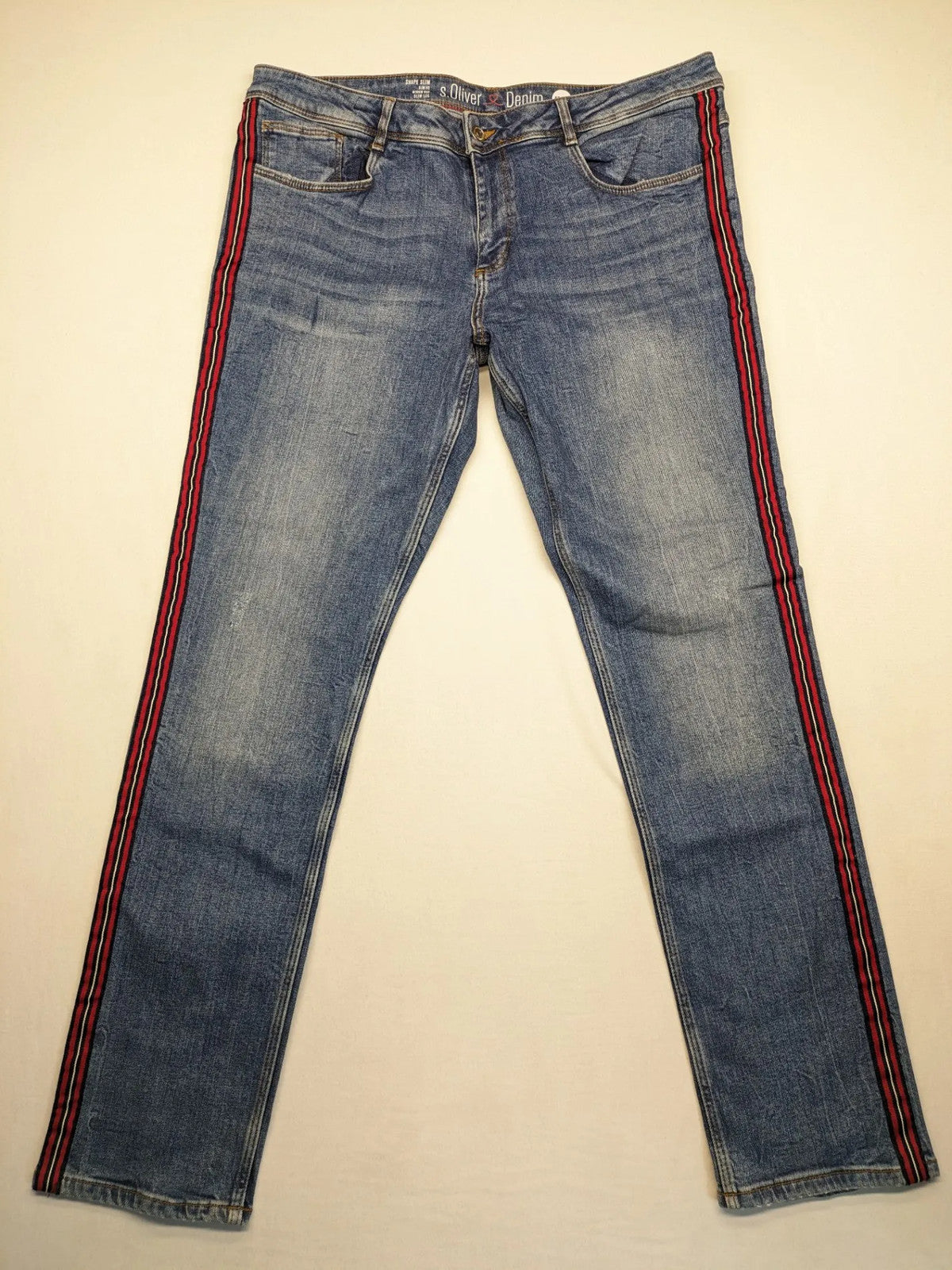 s.Oliver blue straight jeans with red and white side stripes, soft cotton blend material