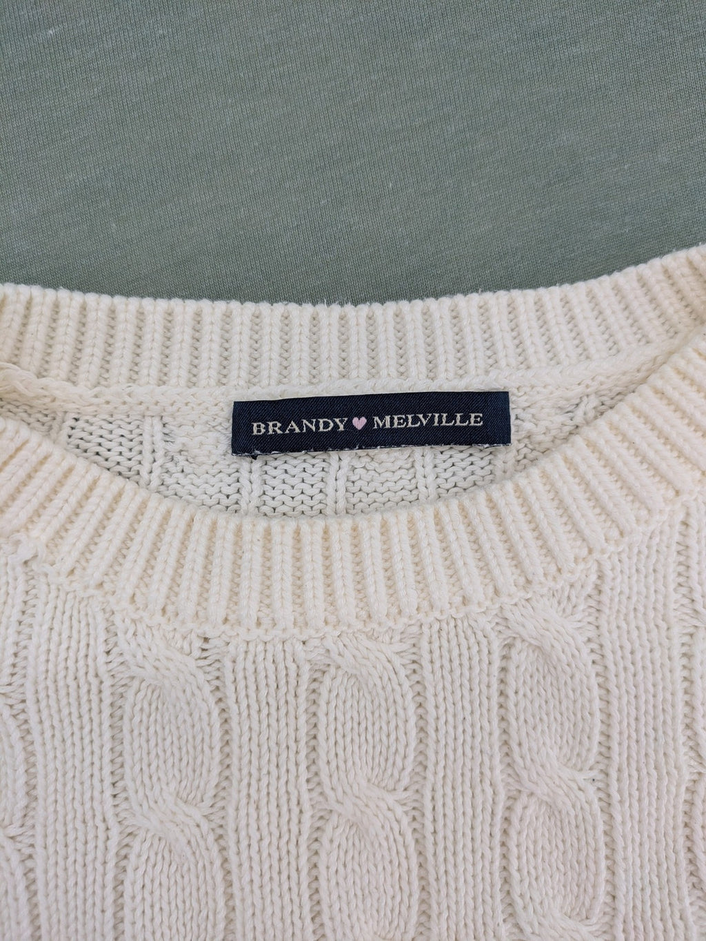 Brandy Melville cream turtle neck jumper with allover cable knit pattern and ribbed hem.
