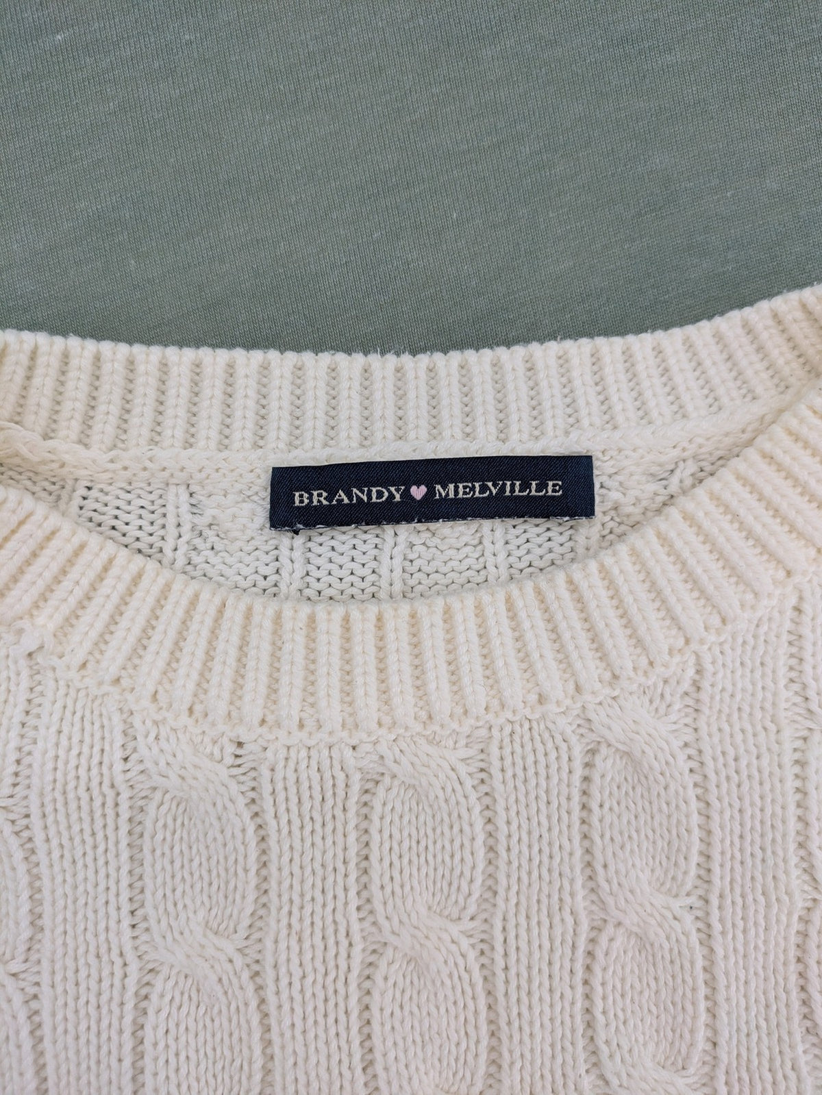Brandy Melville cream turtle neck jumper with allover cable knit pattern and ribbed hem.