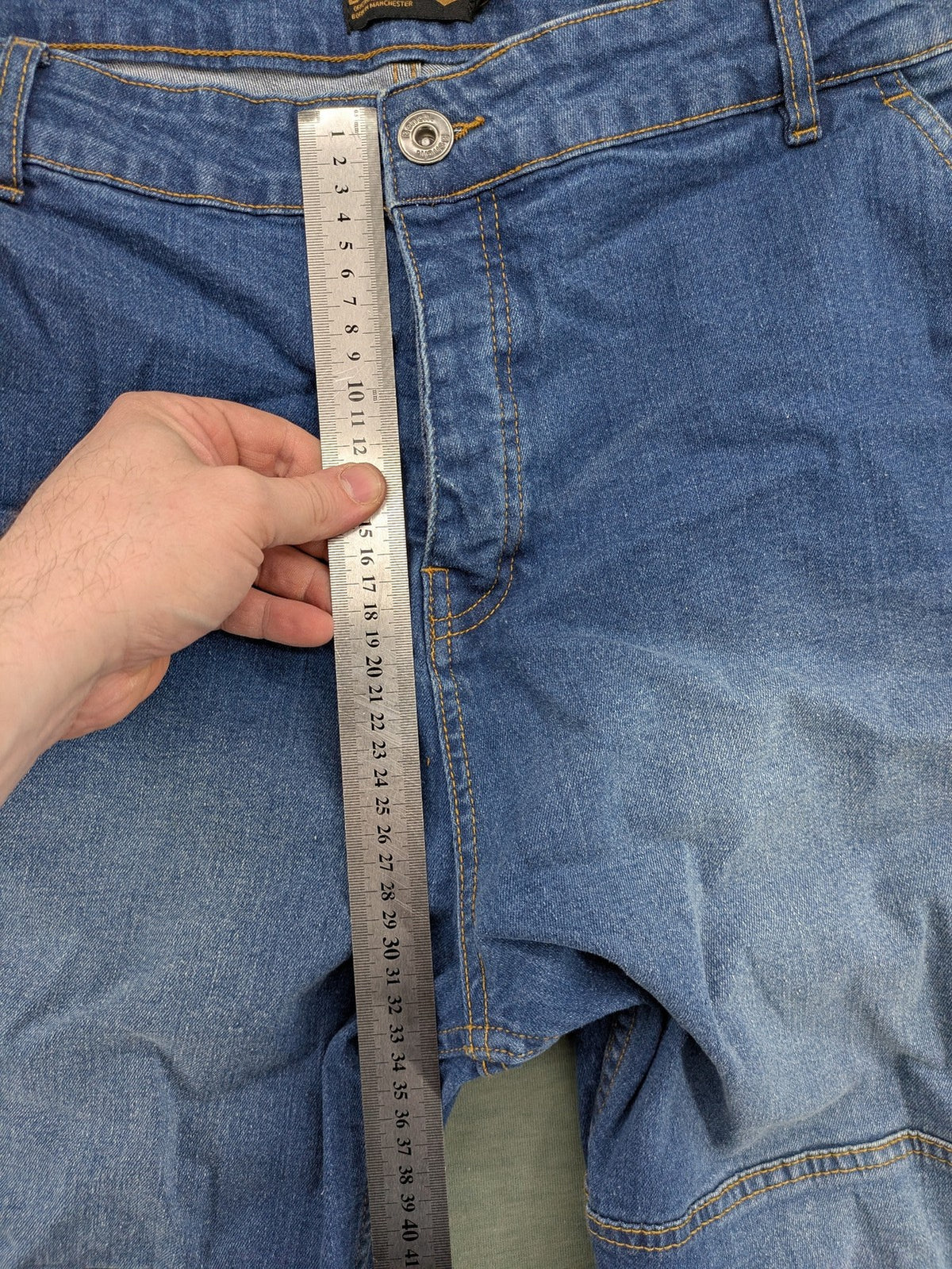 Bench blue straight jeans with reinforced knees and multiple cargo pockets.