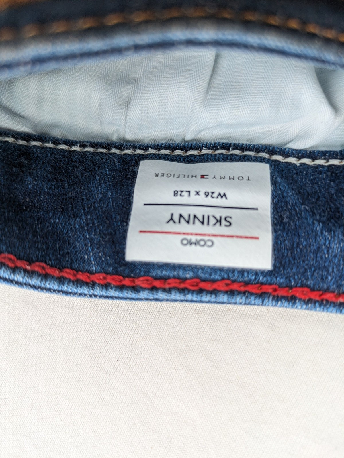 Tommy Hilfiger blue skinny jeans, five-pocket design, made from organic cotton blend.