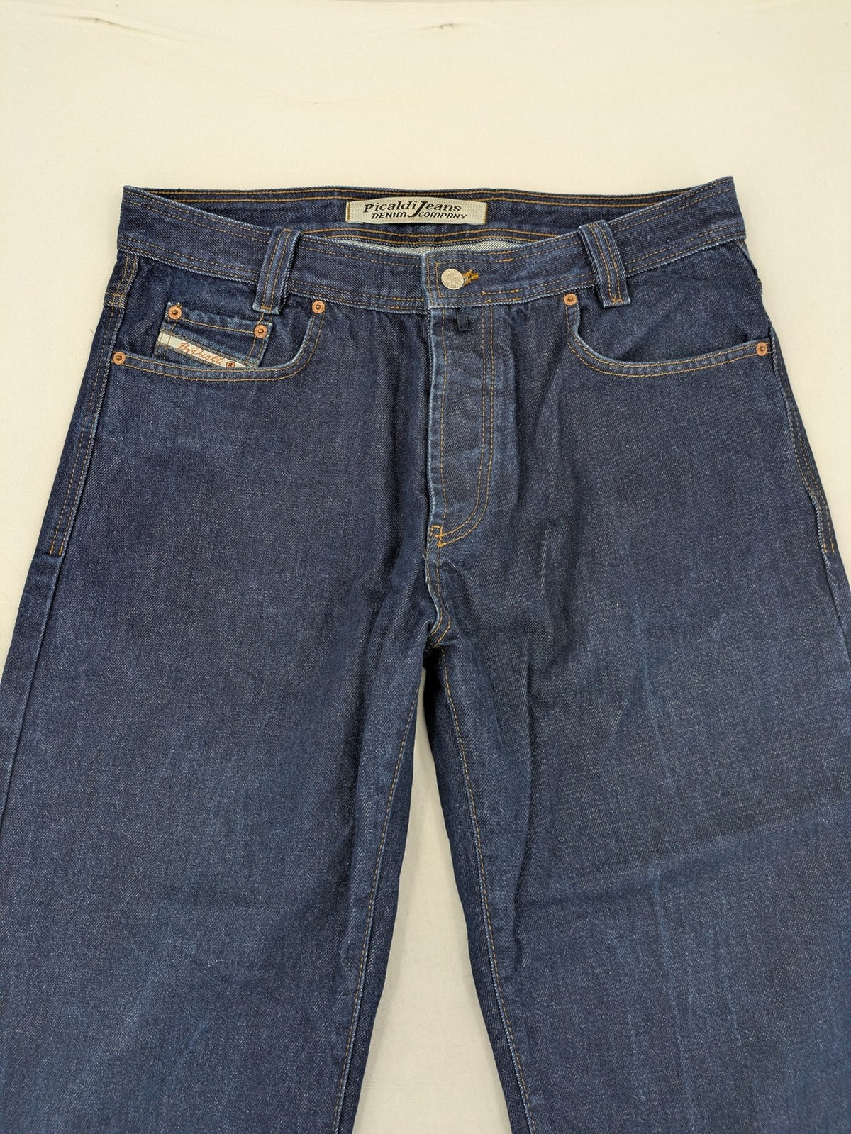 Picaldi blue straight jeans with button fly and frayed hem, 5-pocket design.