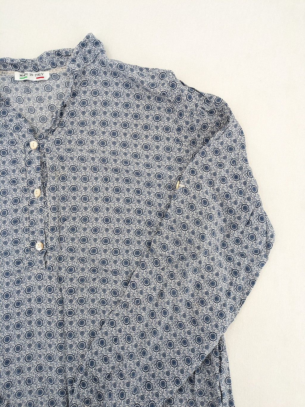 M/L blue and grey tunic top with geometric pattern and stand-up collar.