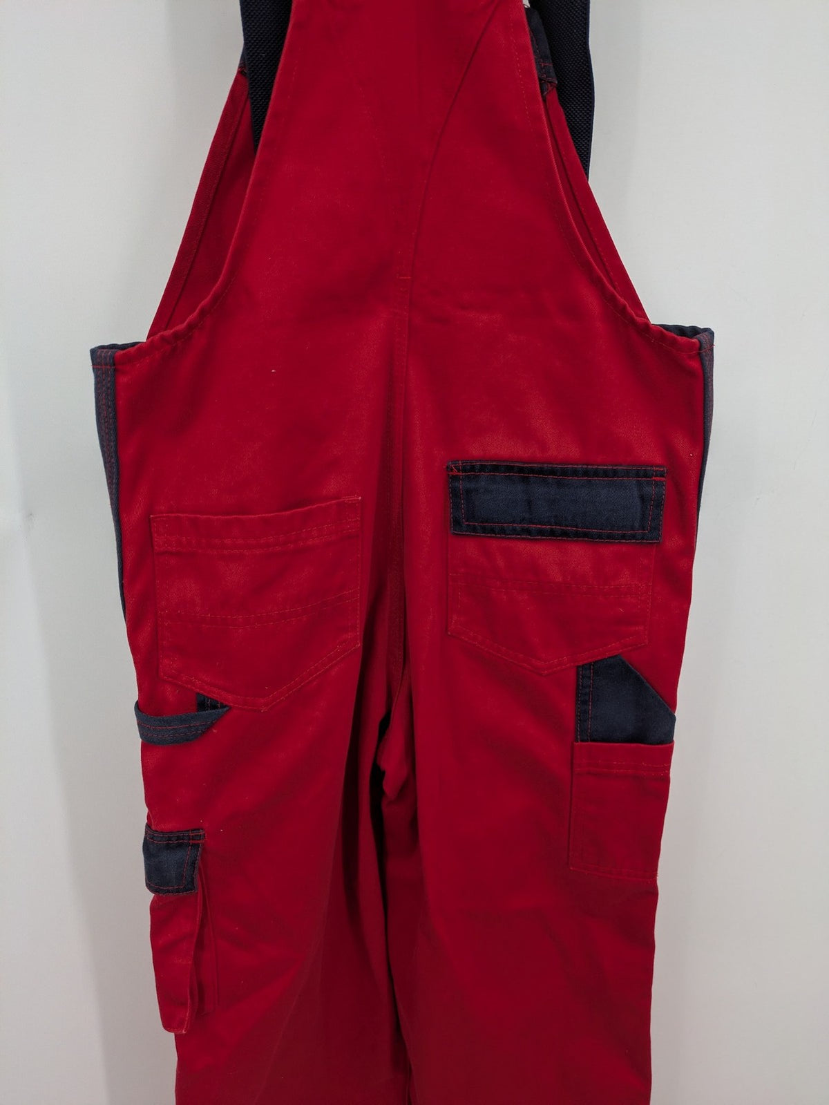 Grene navy red overall with adjustable straps, multiple pockets, and durable material.