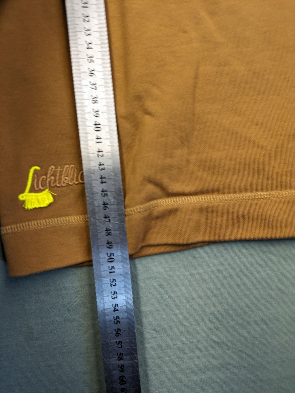 ALS orange crop top sweatshirt with roll neck and embroidered Lichtblick logo.