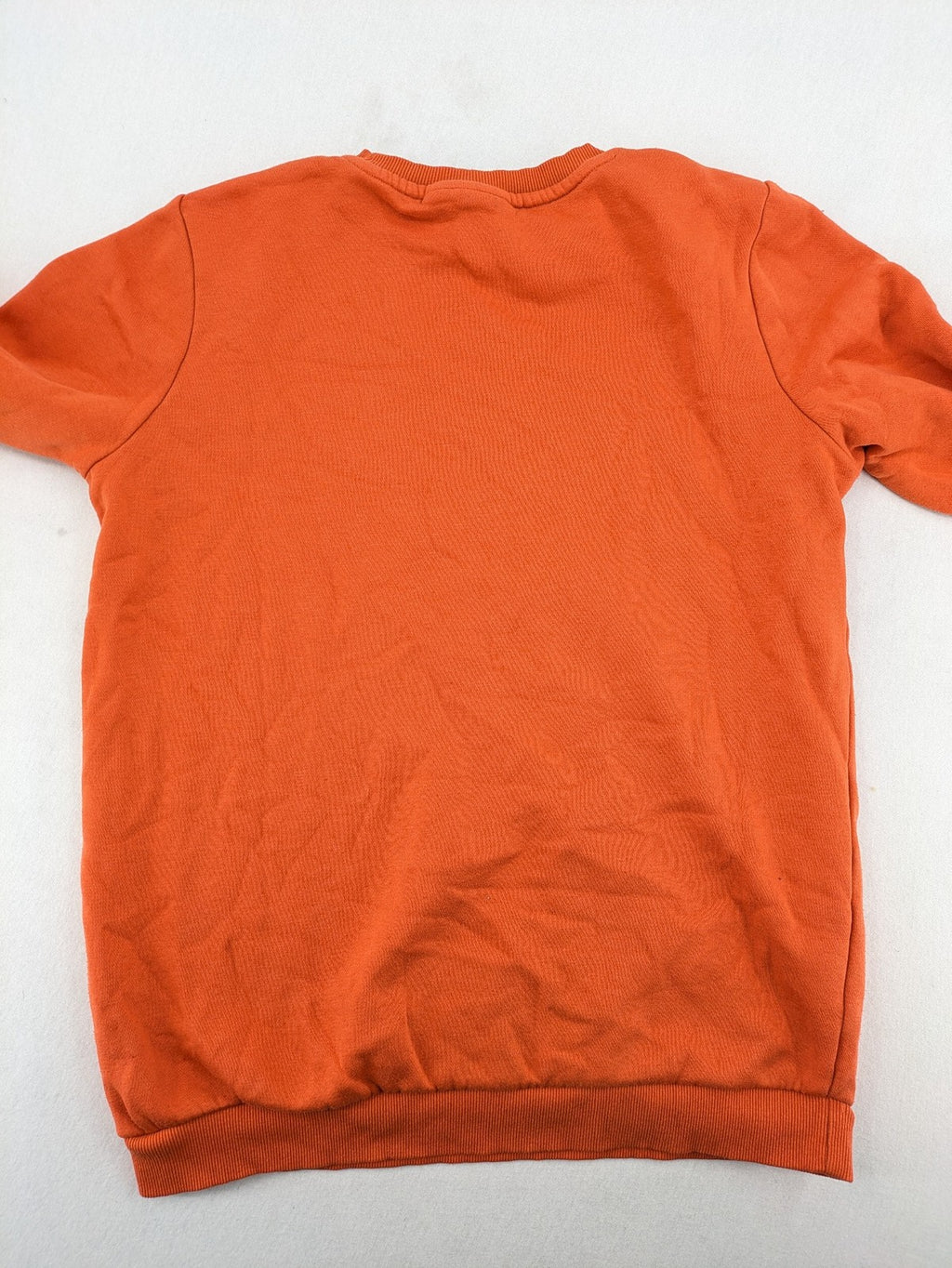 Naruto Shippuden orange sweatshirt featuring vibrant Naruto Uzumaki graphic print, classic crew neck.
