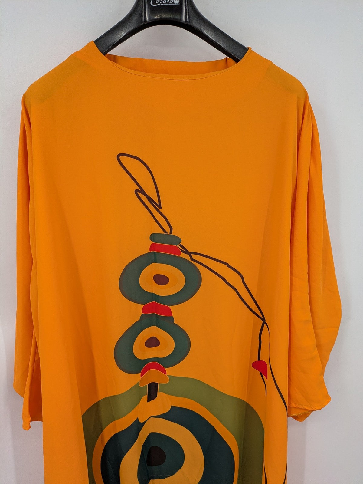 Kaftan orange oversized summer dress with unique graphic print and long sleeves.