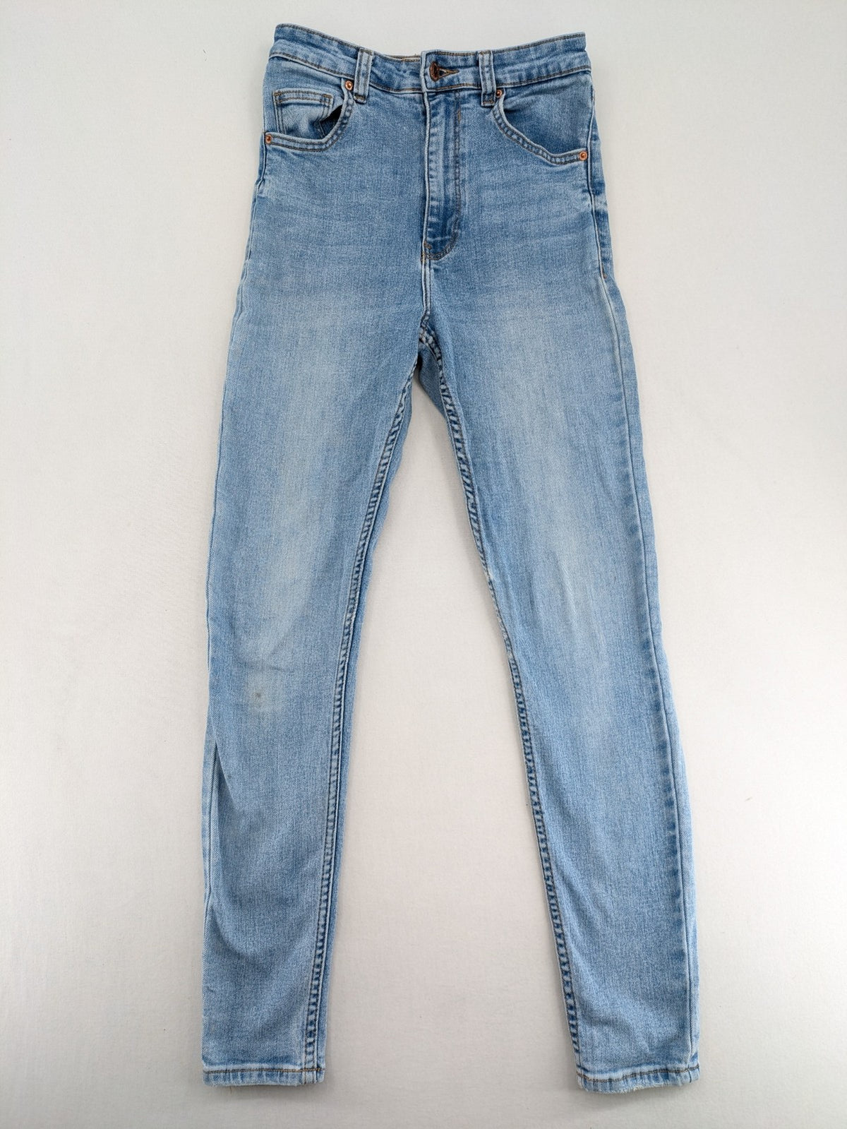 Bershka blue super high waist skinny jeans with washed denim finish and zip closure.