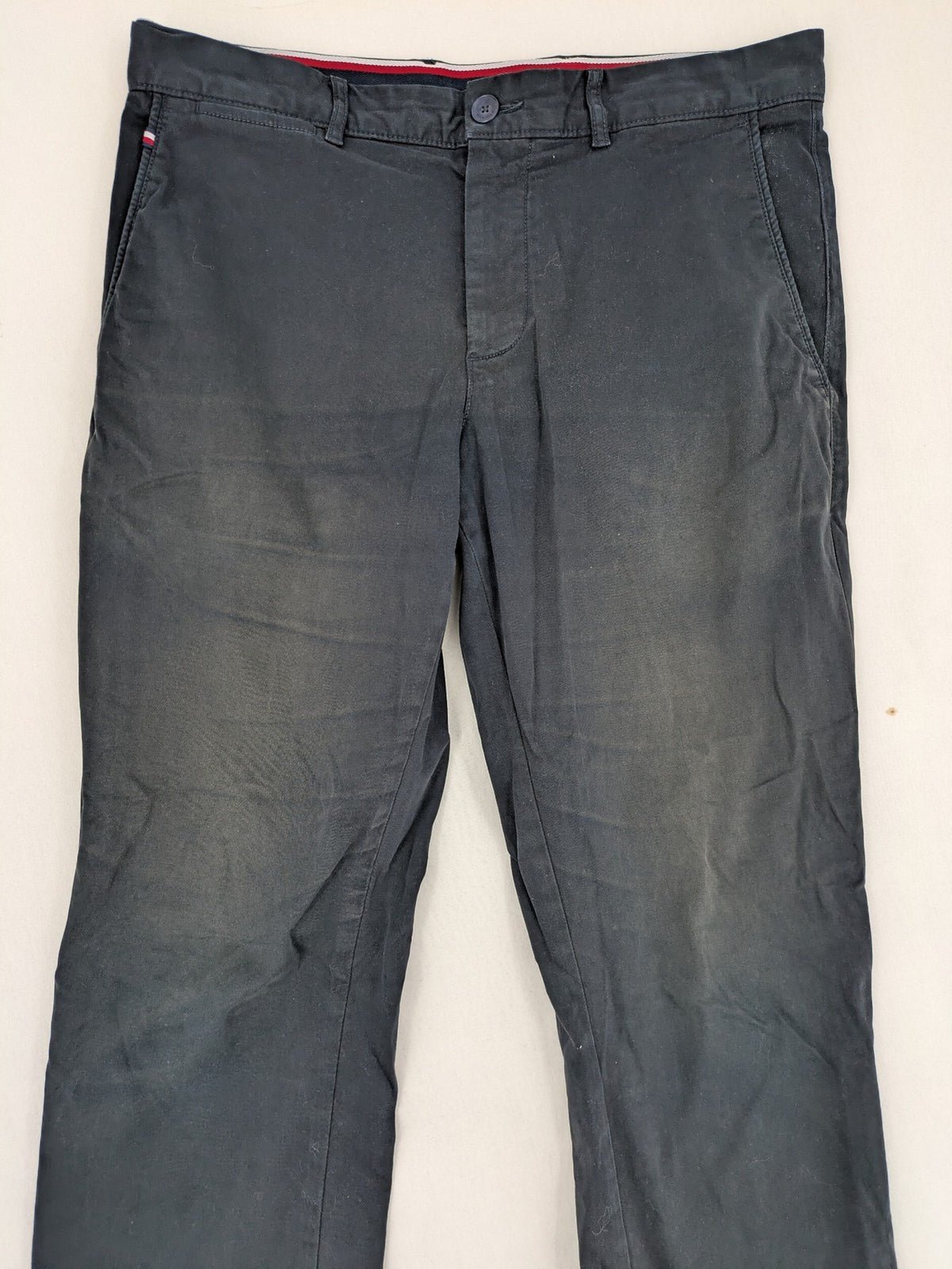 Tommy Hilfiger grey chino pants with TH-Flex stretch technology and classic straight fit design.