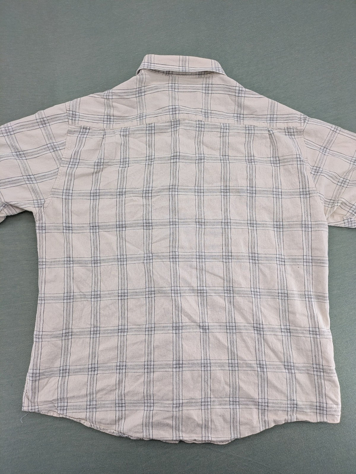 Ken Baker short-sleeve button-down shirt beige blue check pattern with single chest pocket.