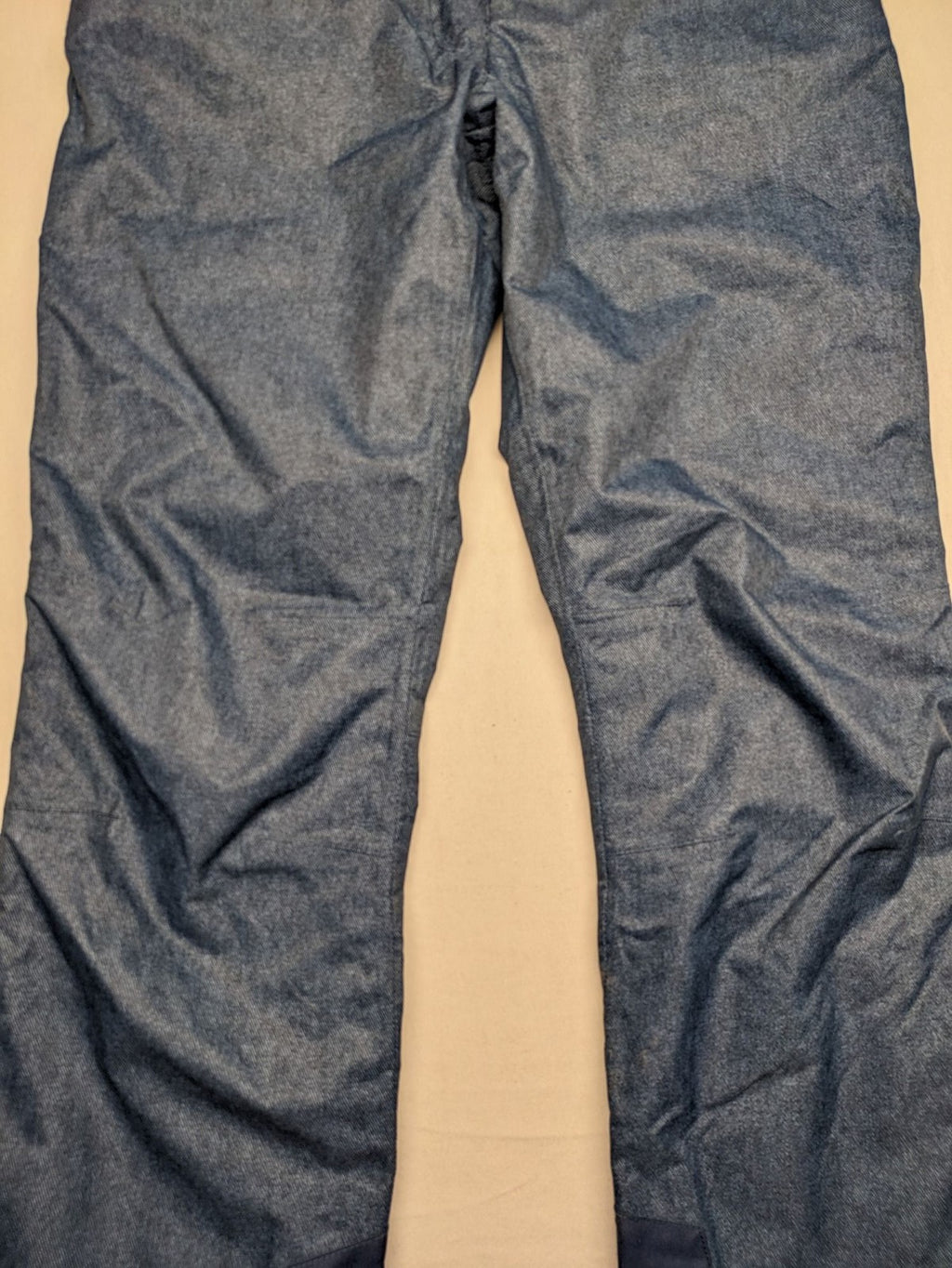 Snow Tech blue ski pants with modern denim look and durable polyester material.