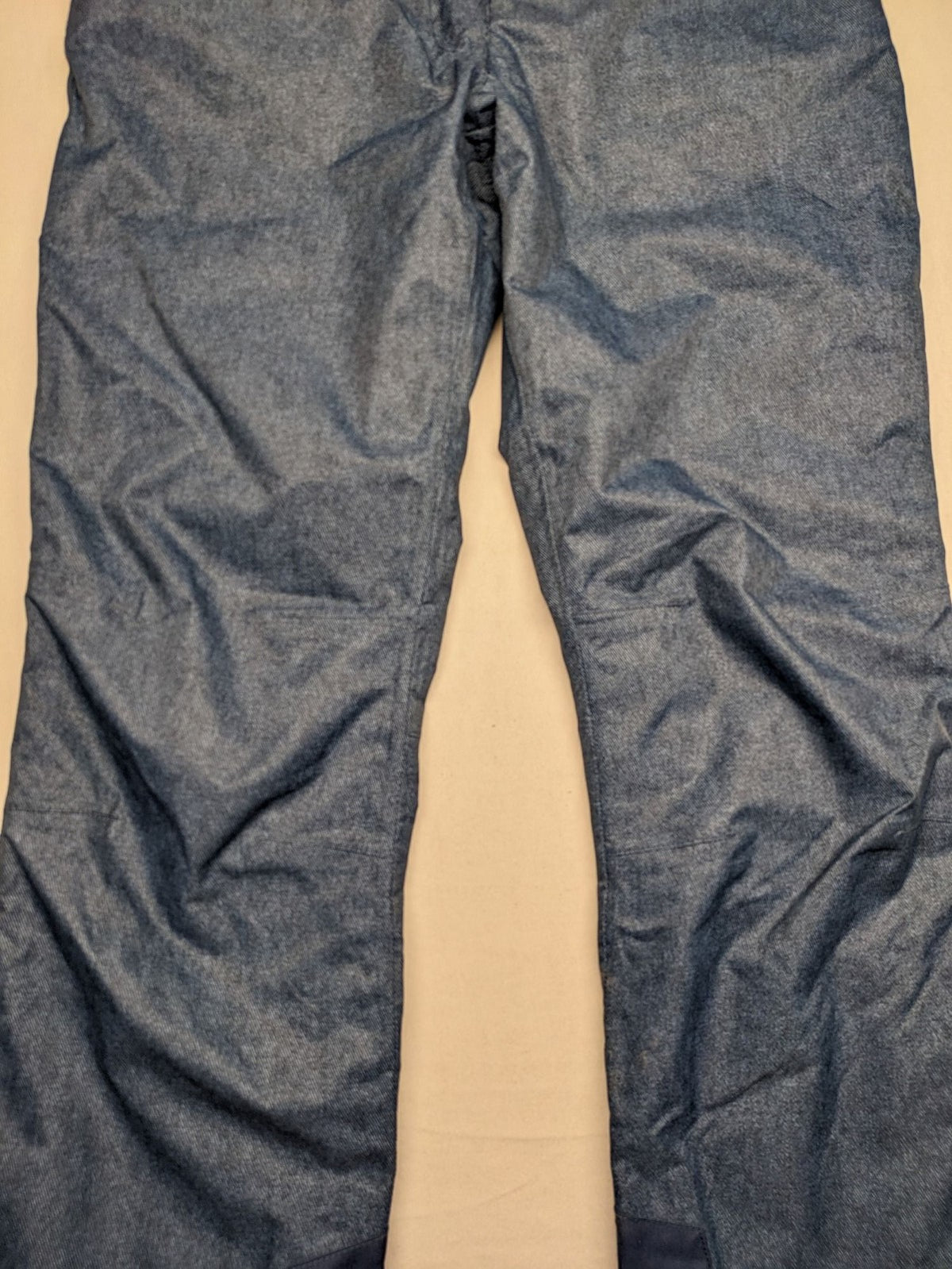 Snow Tech blue ski pants with modern denim look and durable polyester material.