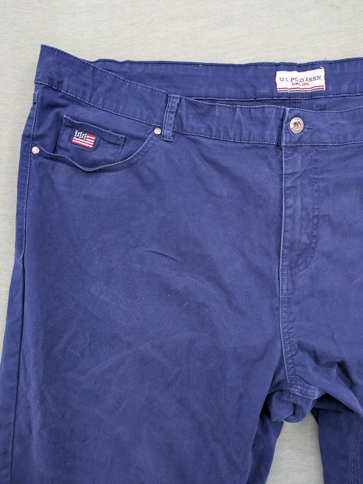 U.S. Polo Assn. navy chino pants classic 5-pocket design with subtle logo stitching