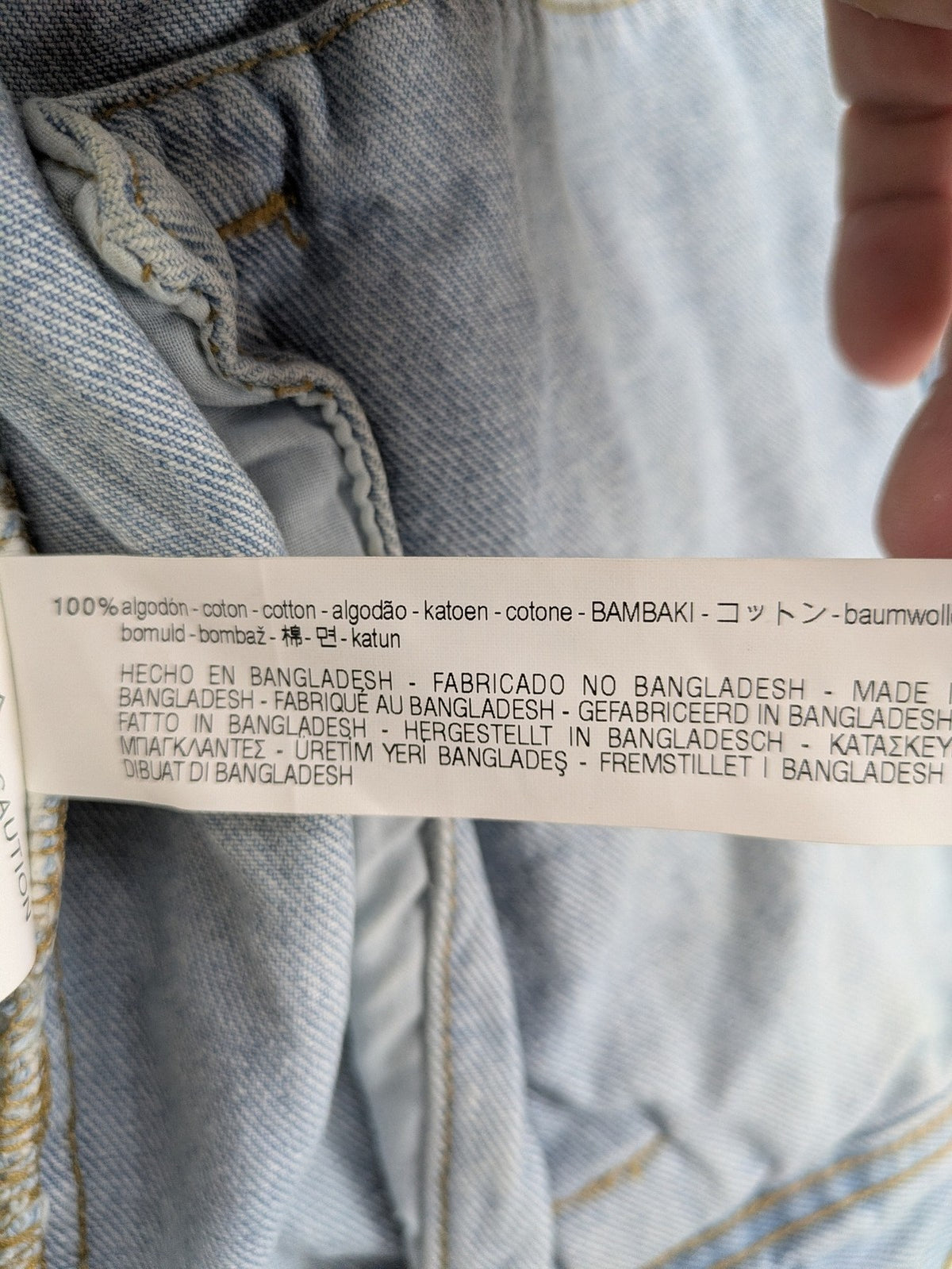 Zara Man blue denim jacket distressed with button closure and chest pockets.