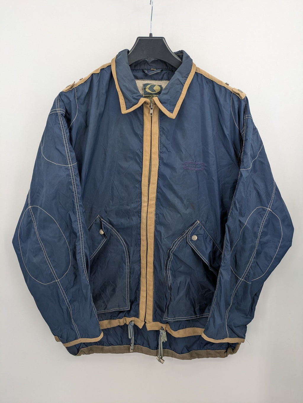 Knock Out navy blue jacket full zip nylon with brown accents and breathable mesh lining.