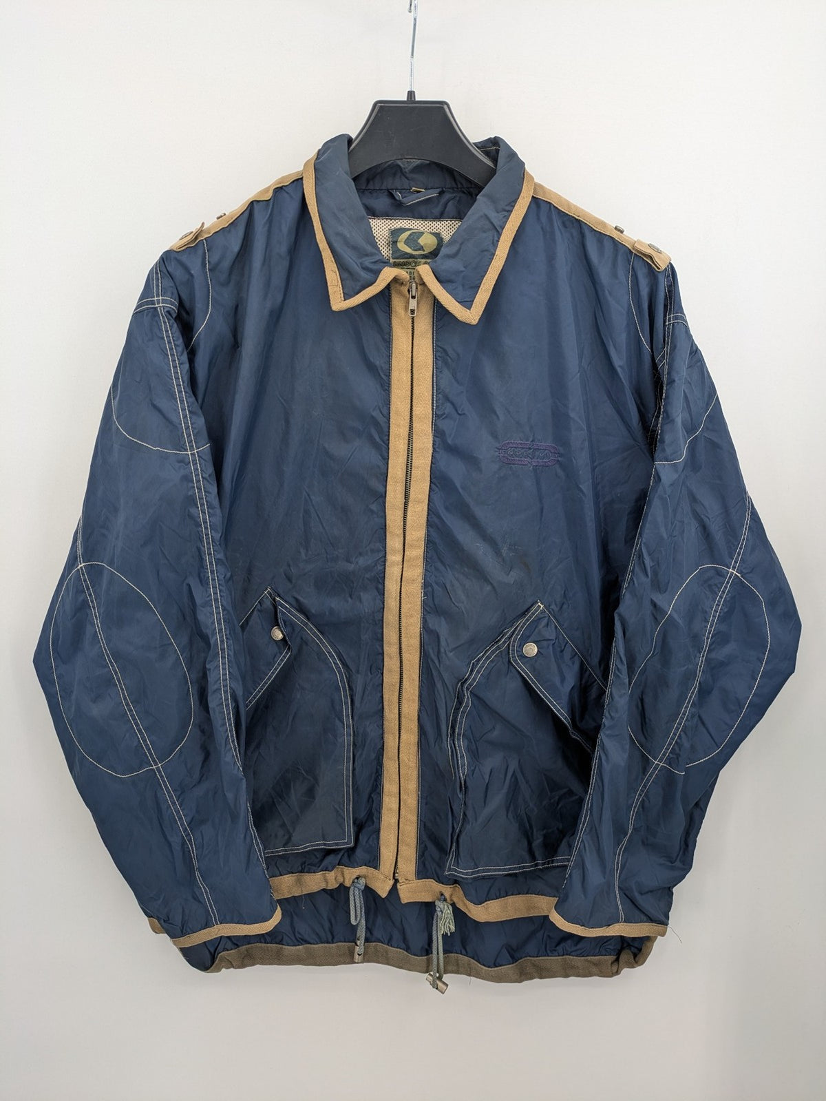 Knock Out navy blue jacket full zip nylon with brown accents and breathable mesh lining.