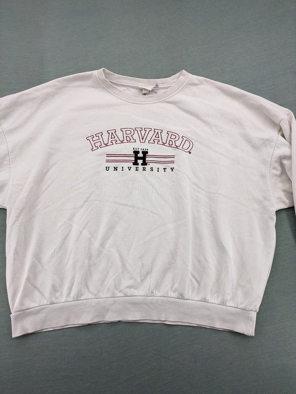 H&M cream turtle neck jumper embroidered Harvard University logo, soft cotton blend.