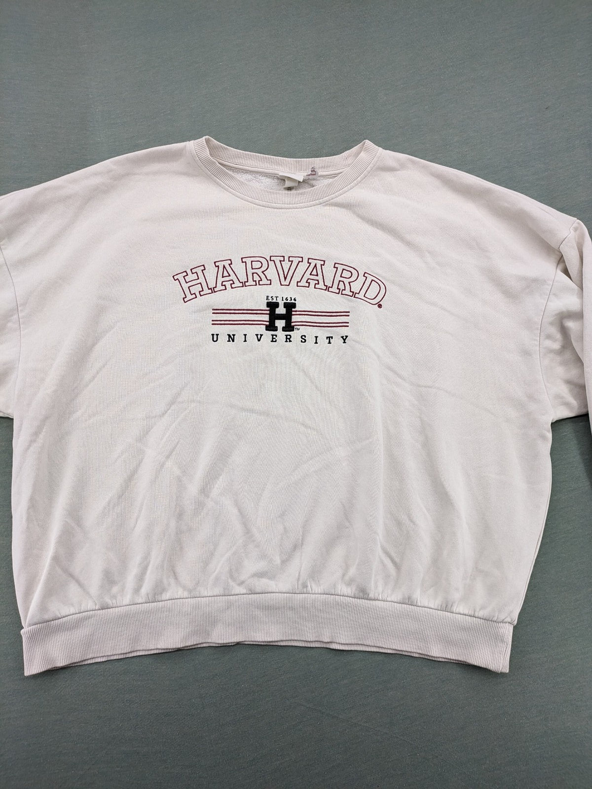 H&M cream turtle neck jumper embroidered Harvard University logo, soft cotton blend.