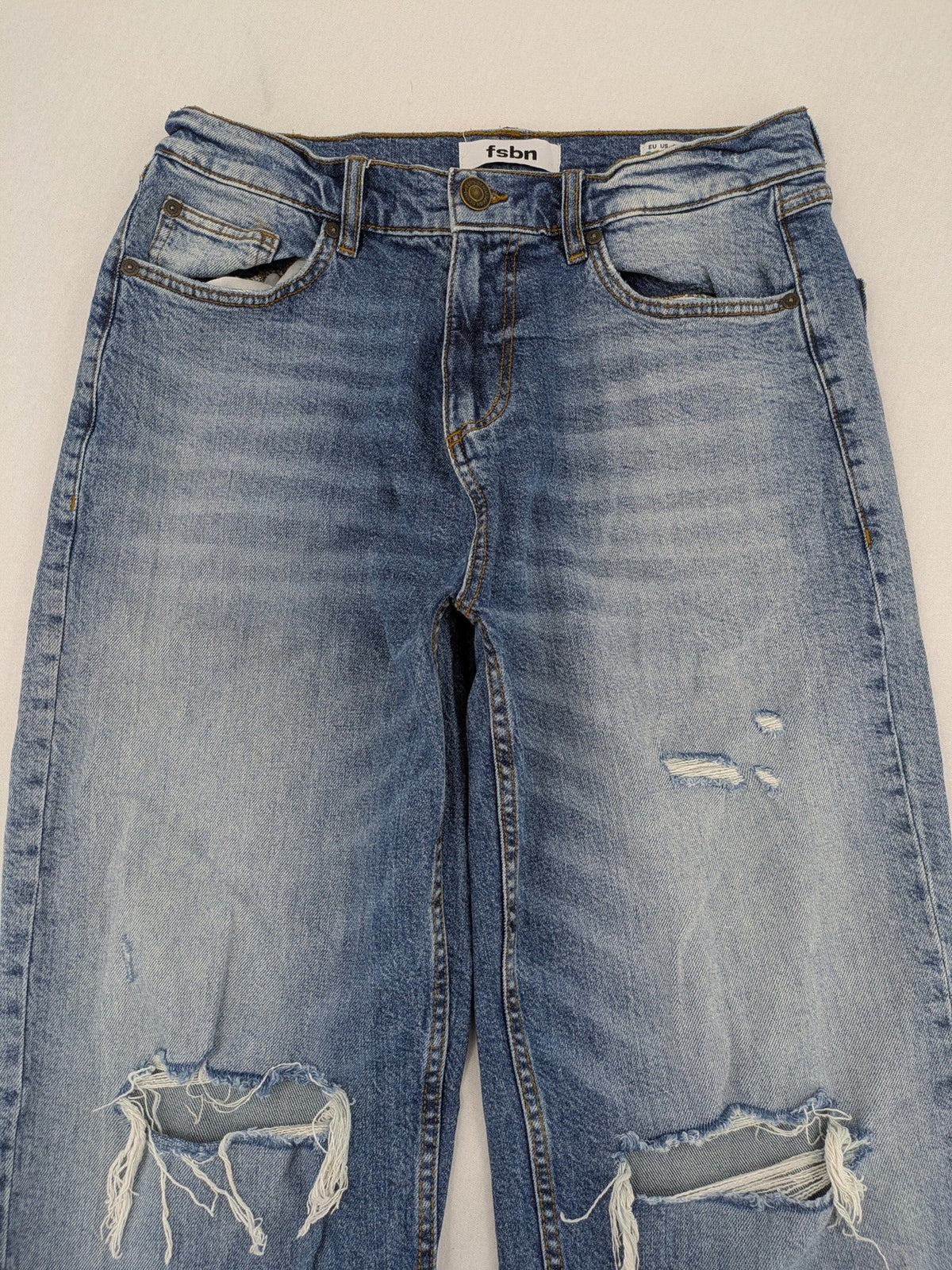 FSBN blue straight jeans with ripped distressed knees and classic button fly.