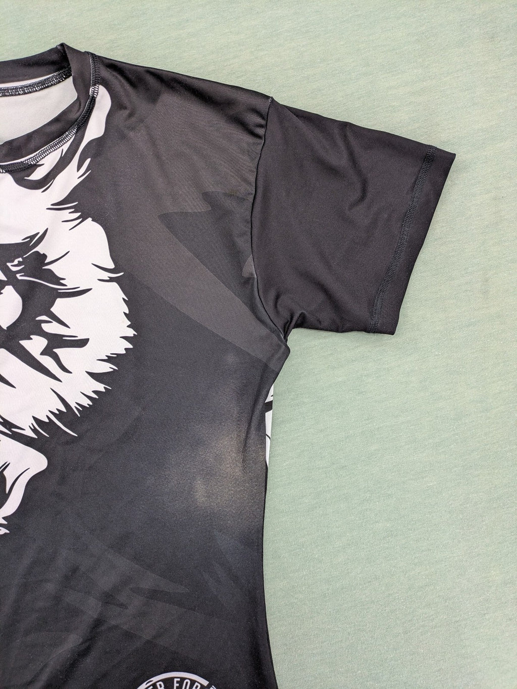 FORMMMA black rashguard featuring striking white wolf graphic and "Chechen Warrior" text.