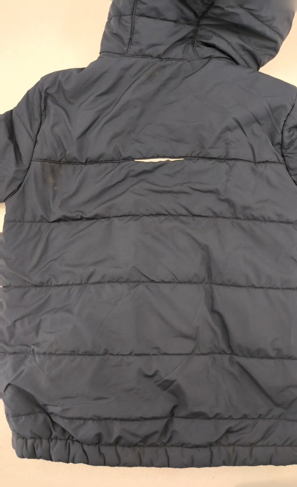 Jack Wolfskin cream and navy puffer coat with quilted design and Sherpa fleece lining.