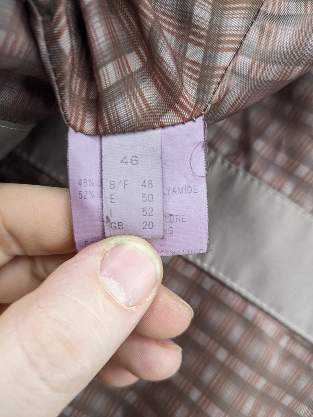 Goldix beige coat with checkered lining and Sympatex waterproof technology.