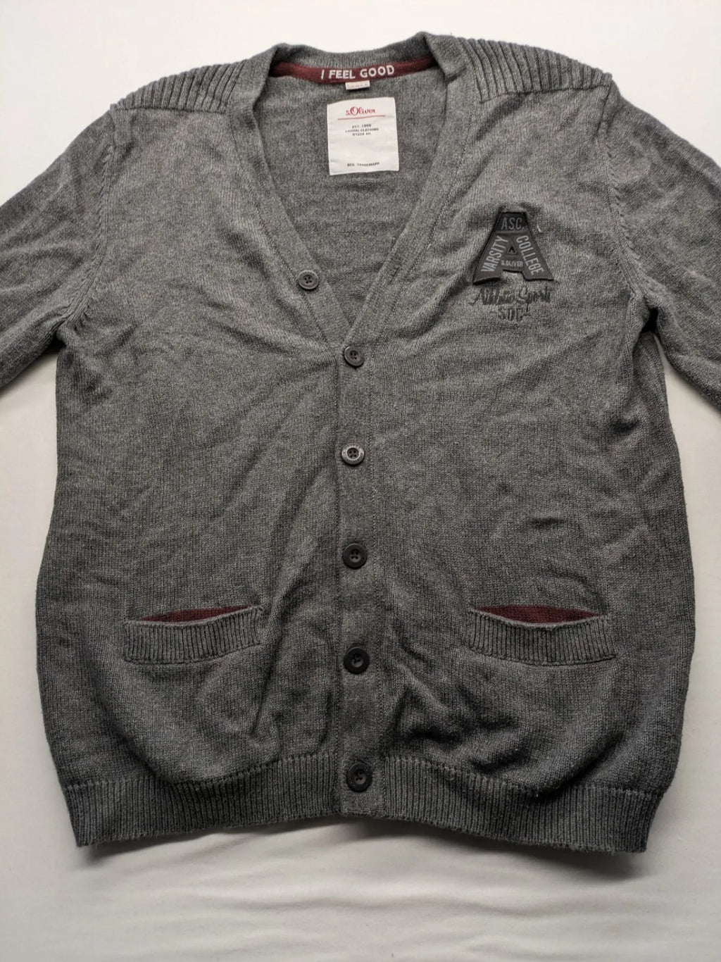 s.Oliver grey turtle neck jumper with varsity college patch and button closure.