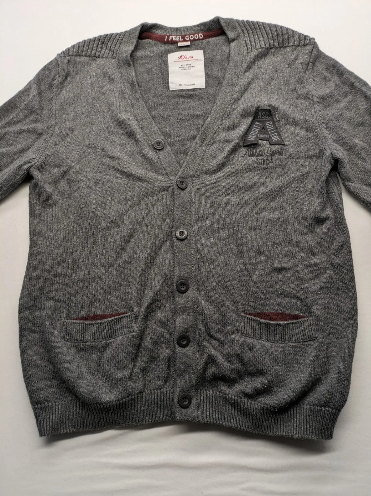 s.Oliver grey turtle neck jumper with varsity college patch and button closure.