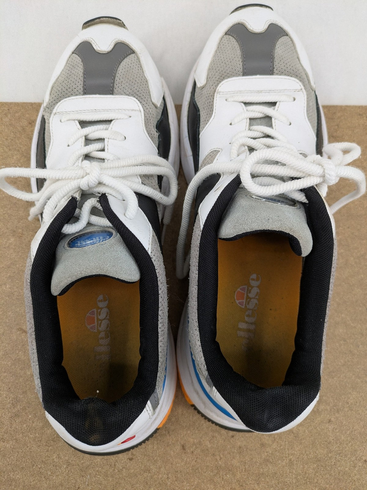 Ellesse Aurora chunky sneakers white grey with orange accents and multi-material upper.