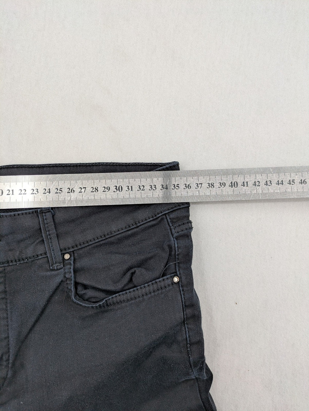 Massimo Dutti grey skinny fit jeans with coated finish and sleek silhouette.