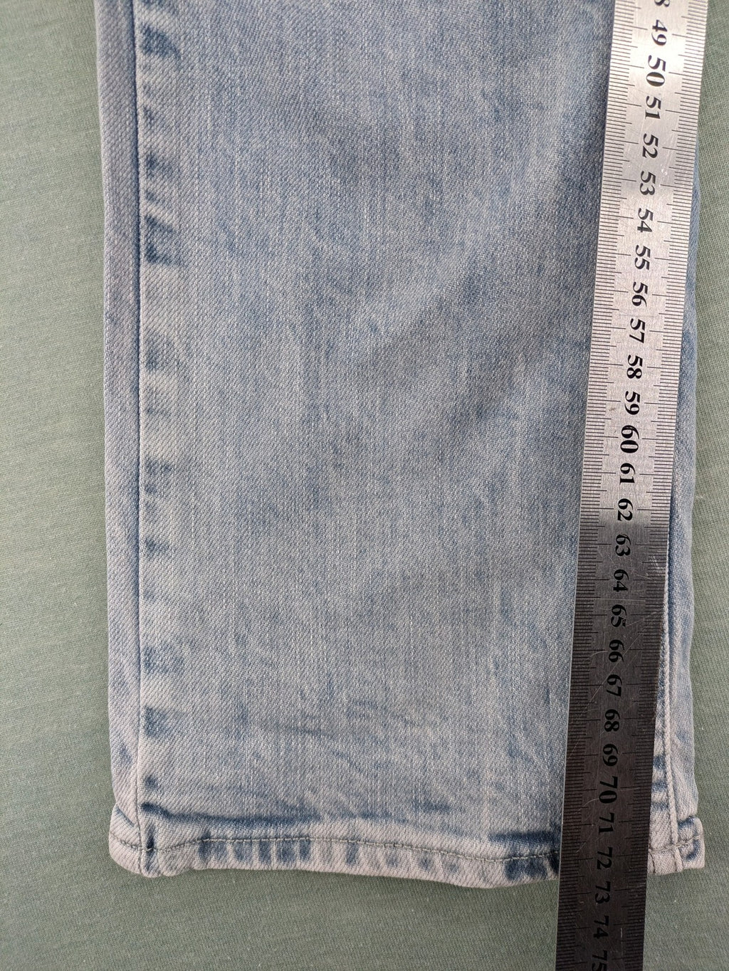 G-Star Raw blue straight leg jeans with classic 5-pocket design and light wash denim.