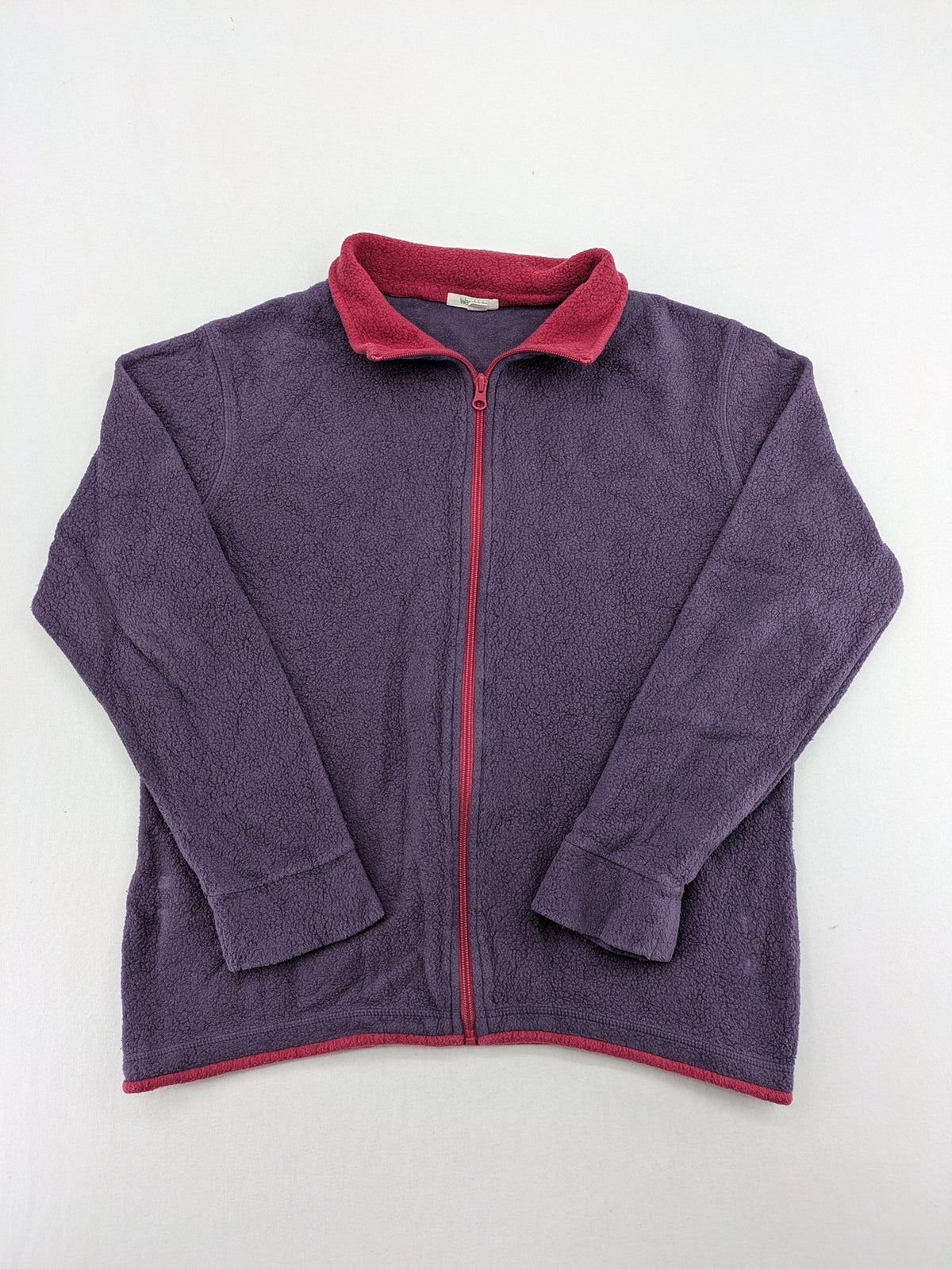 Waschbär pink and purple fleece jacket with red contrast details and high collar.