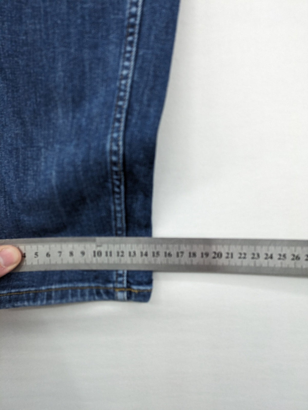 H&M blue skinny jeans with stretch denim and slim fit design.