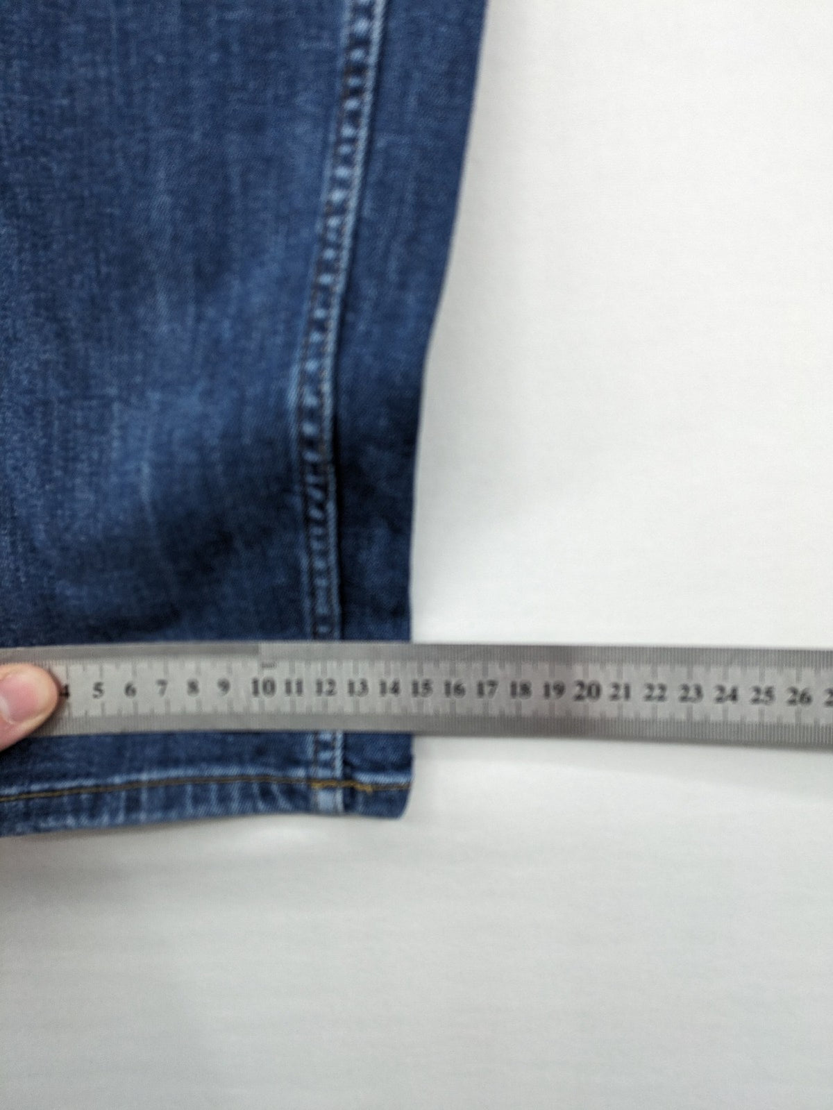 H&M blue skinny jeans with stretch denim and slim fit design.