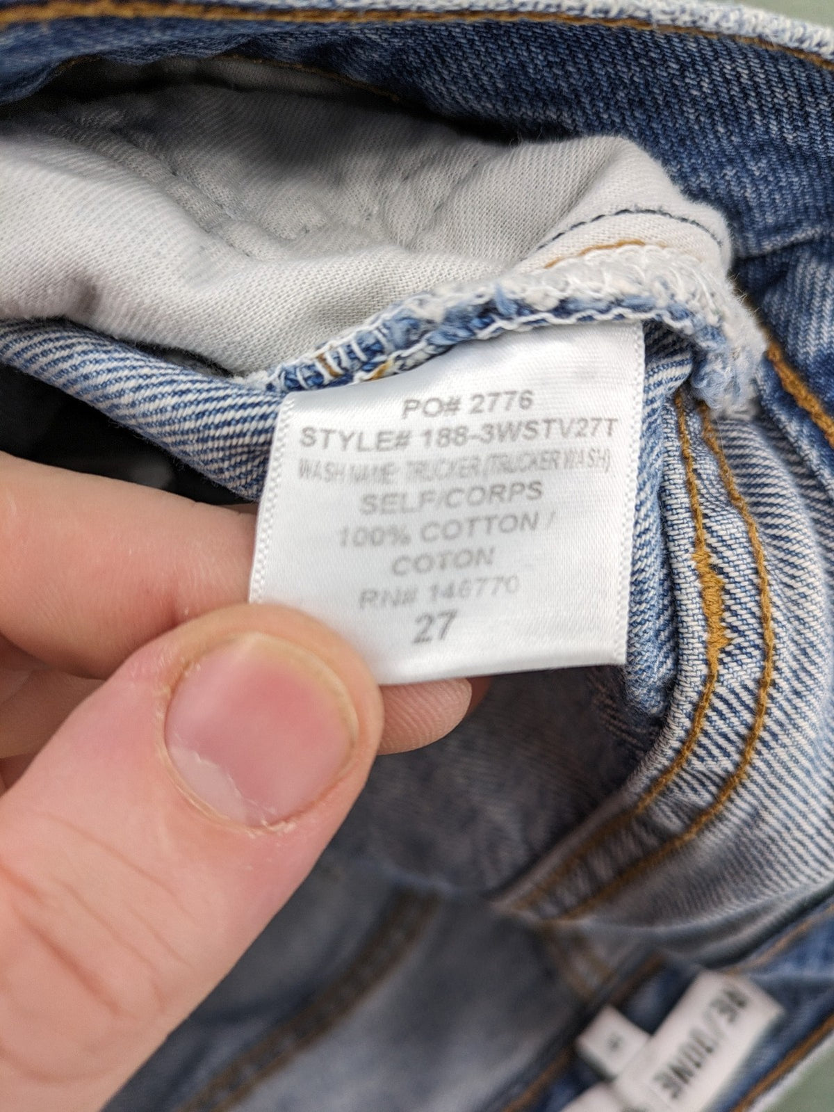Re/Done blue straight jeans high rise with button fly and raw hem detail.