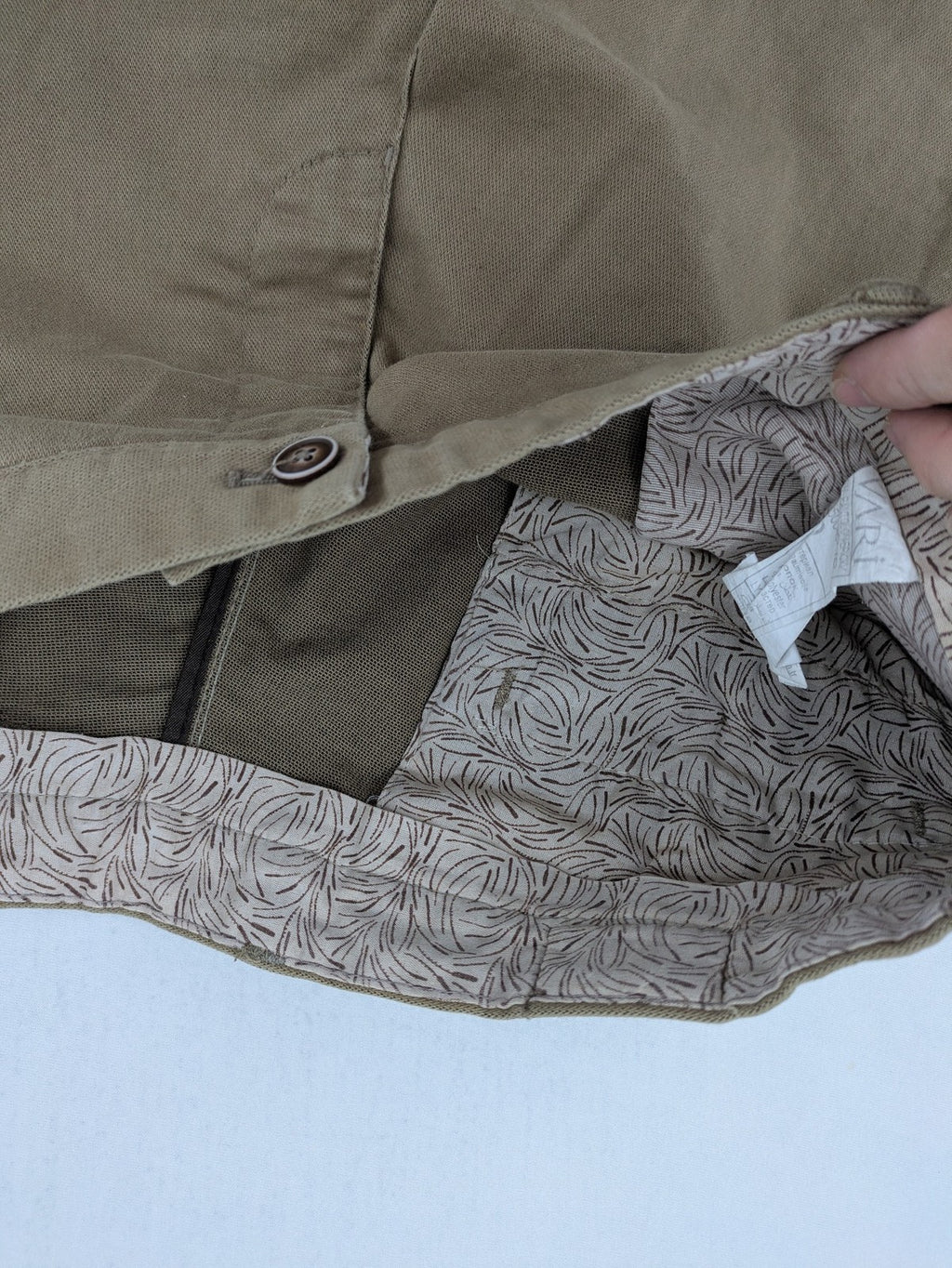 Süvari khaki chino pants flat-front design with patterned waistband detail, cotton blend material.