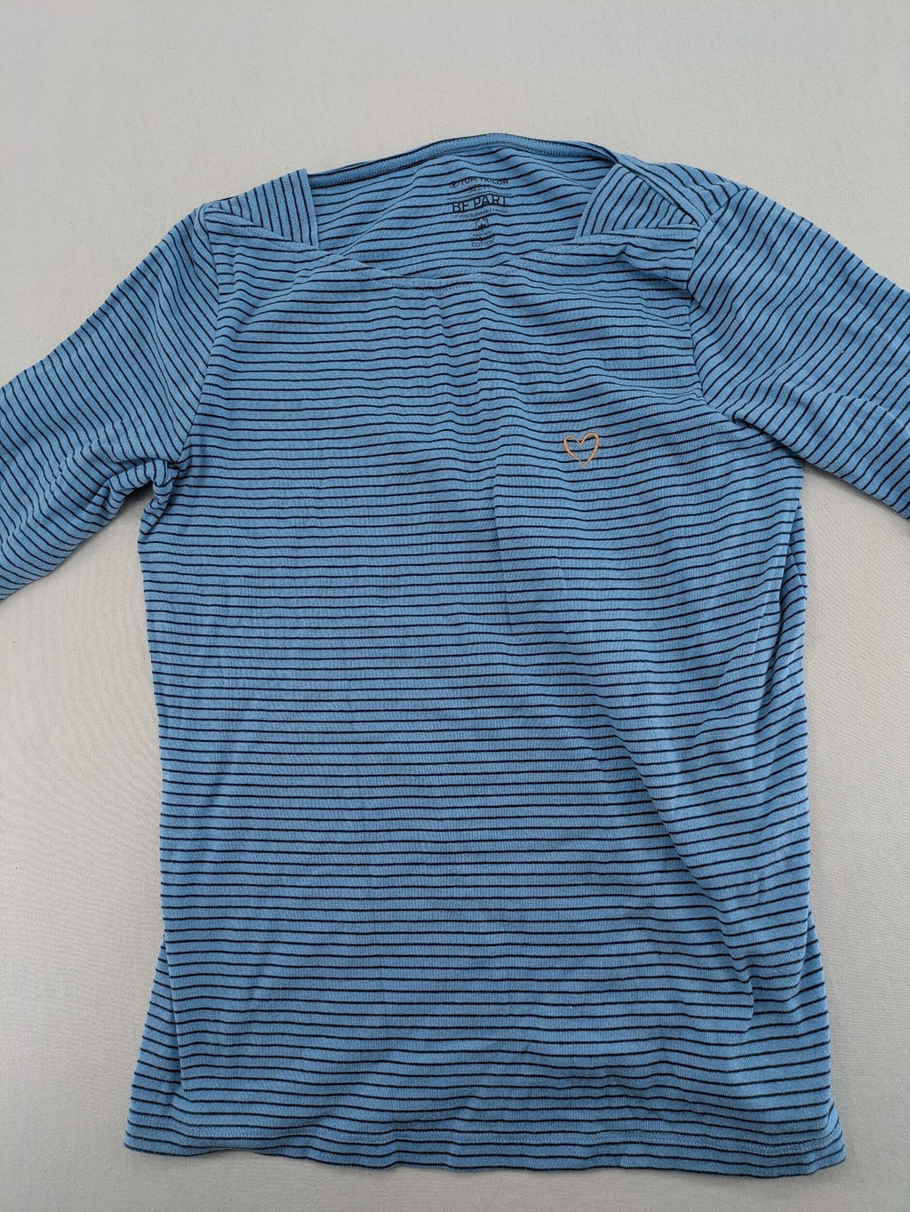 Tom Tailor blue striped top with gold heart emblem, made from organic cotton.