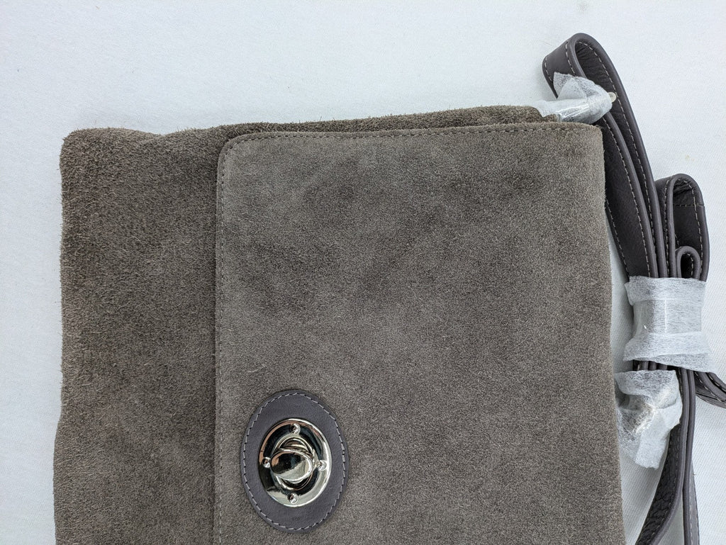 CNTMP grey suede crossbody handbag with flap and silver twist lock closure.