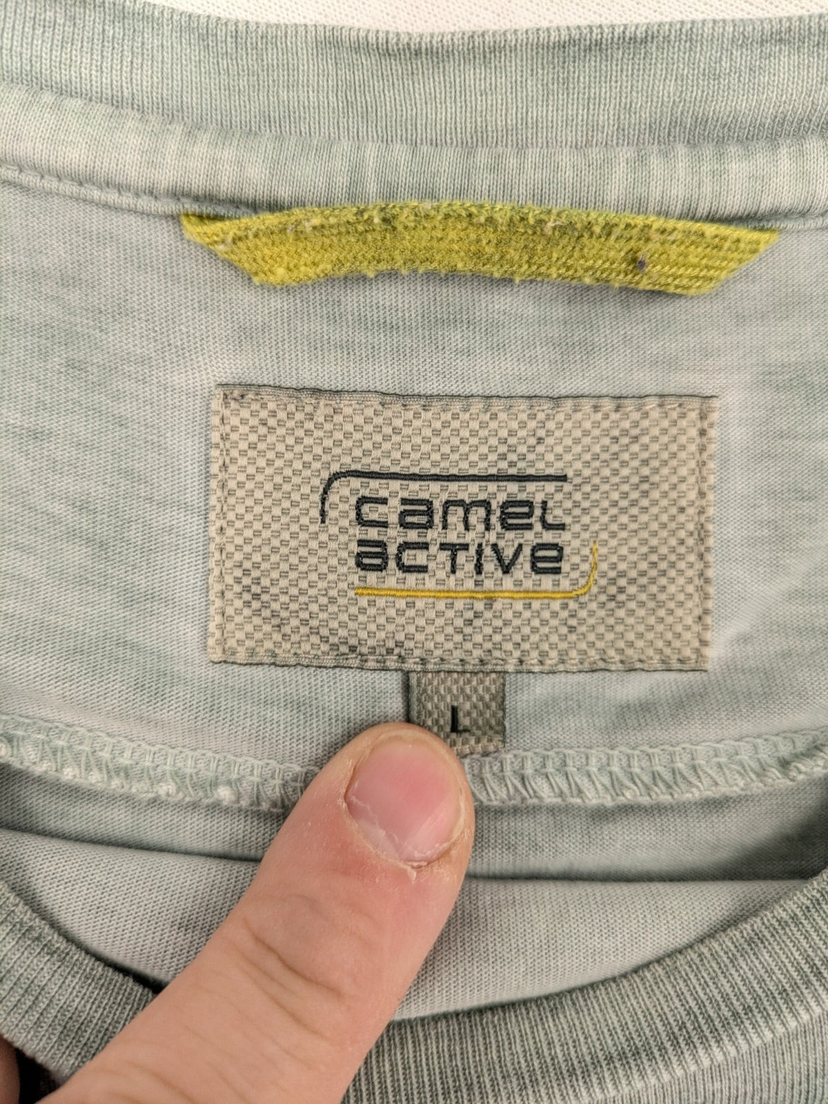 Camel Active green t-shirt with striped chest pocket and used look cotton fabric.