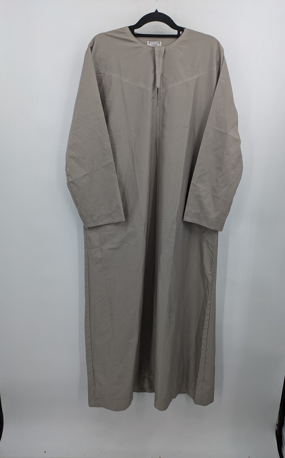 Aleasha beige kaftan thobe long sleeve with subtle embroidery and side pockets.