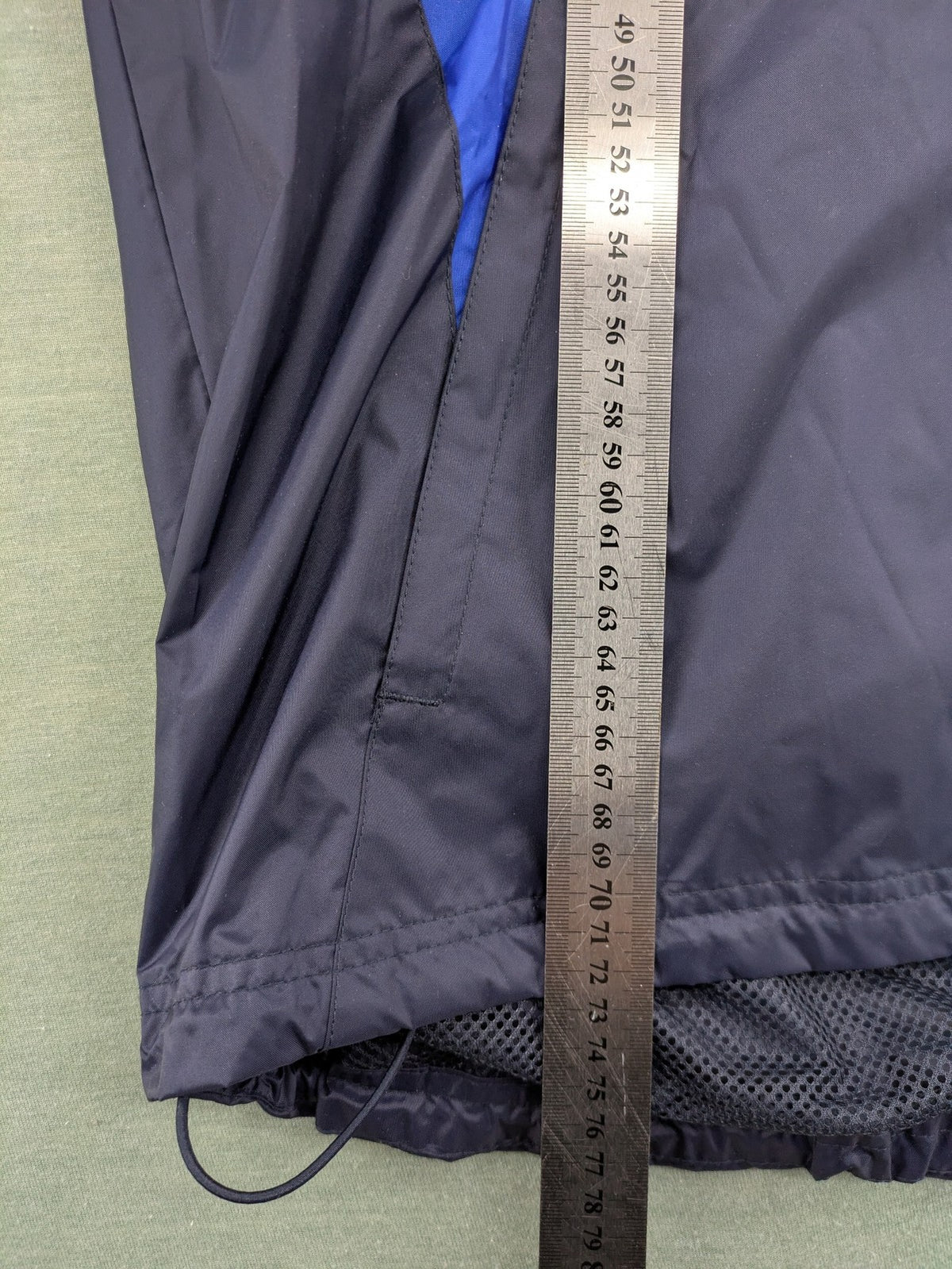 Jako navy windbreaker full zip jacket with breathable mesh lining and logo details.