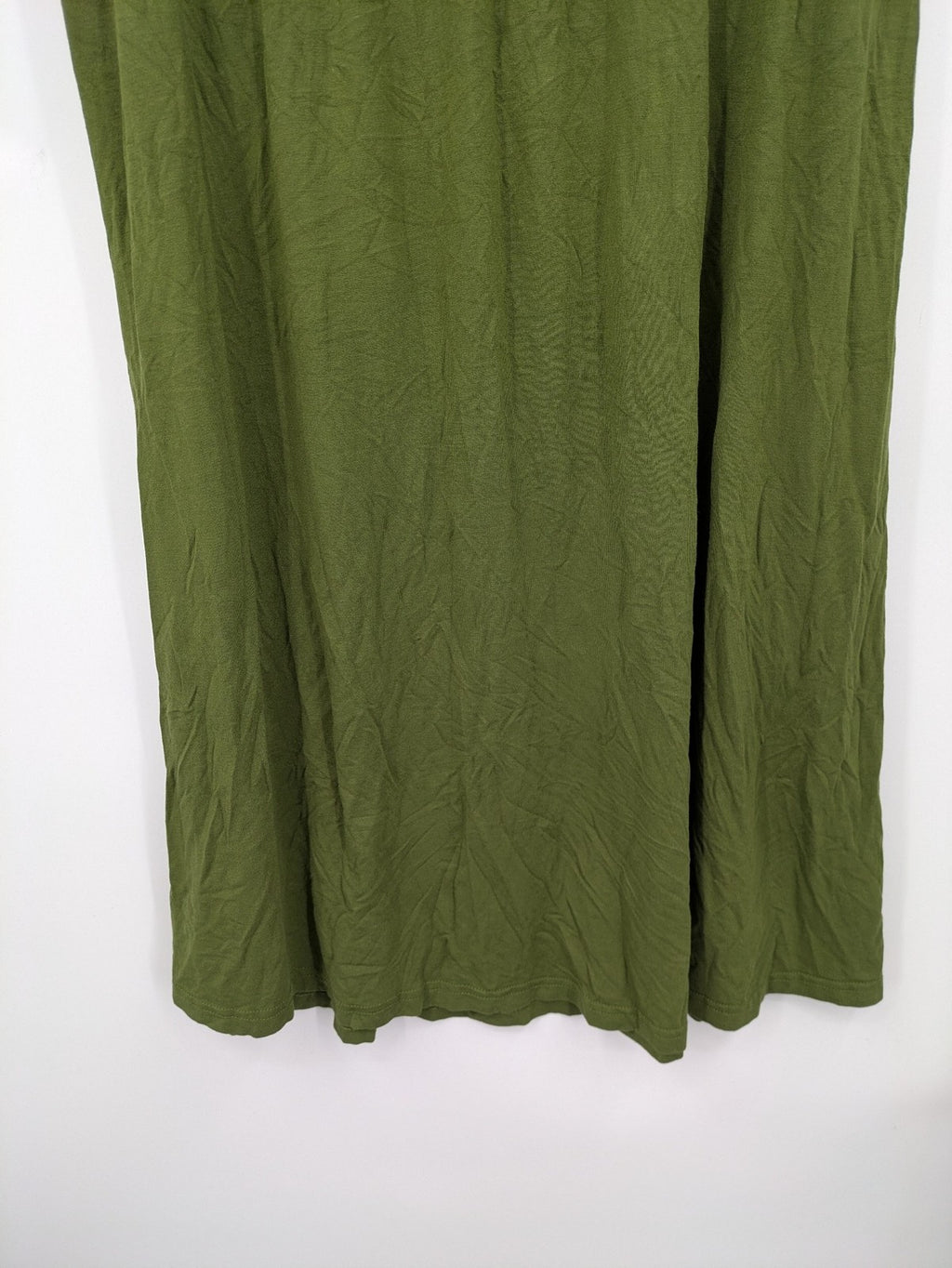 Bonprix green maternity dress with layered V-neck and empire waist design.